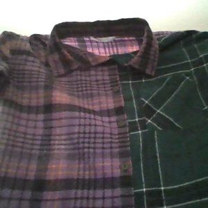 A purple and green flannel in a size large kids